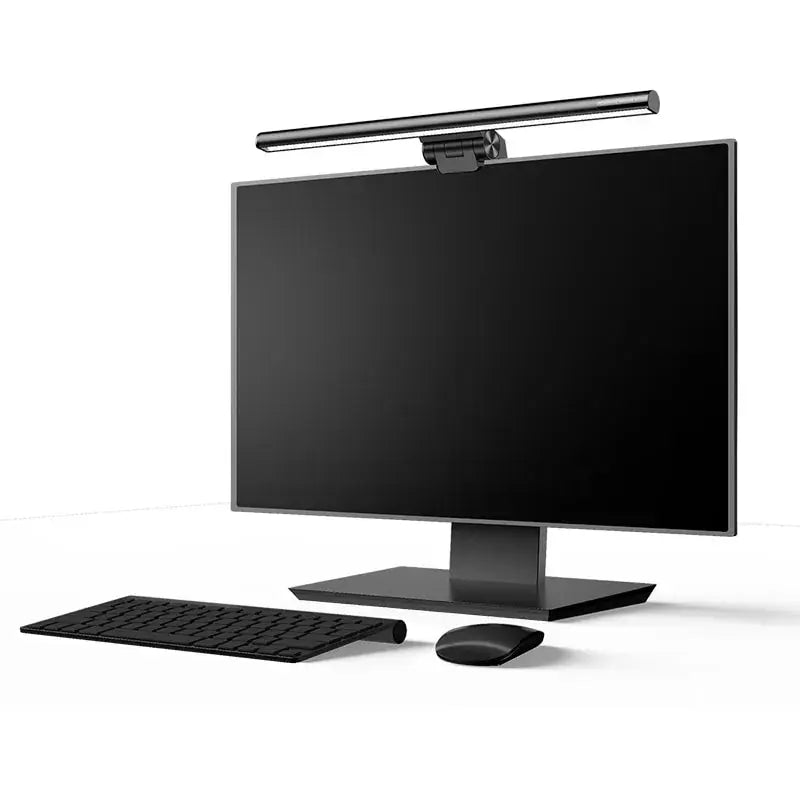 Simple view of the monitor lamp on a computer monitor sitting on a white desk with a white background.