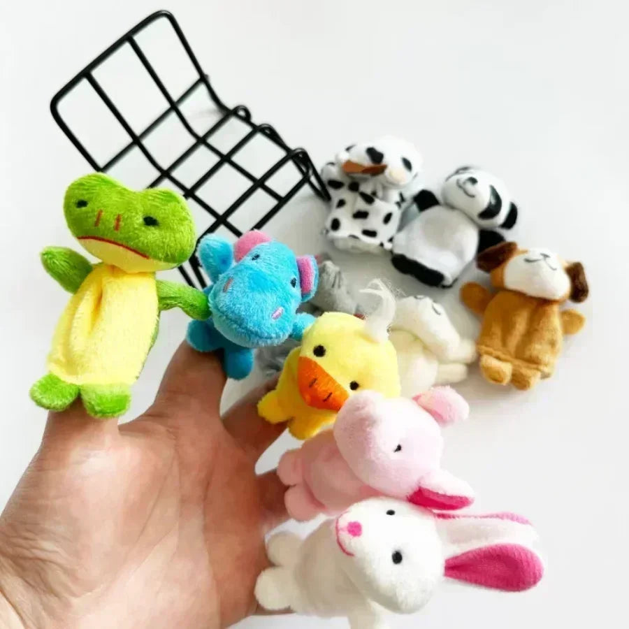 5 animal finger puppets on a person's hand with 3 more laying on a white background behind