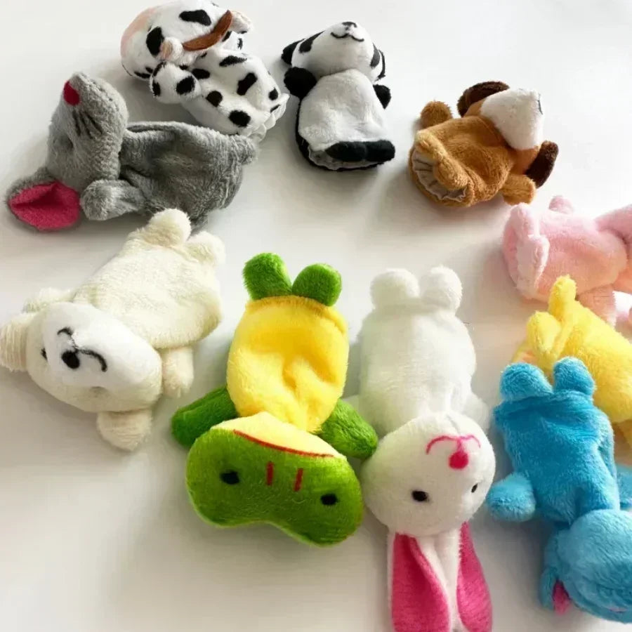 10 animal finger puppets laying on a white surface